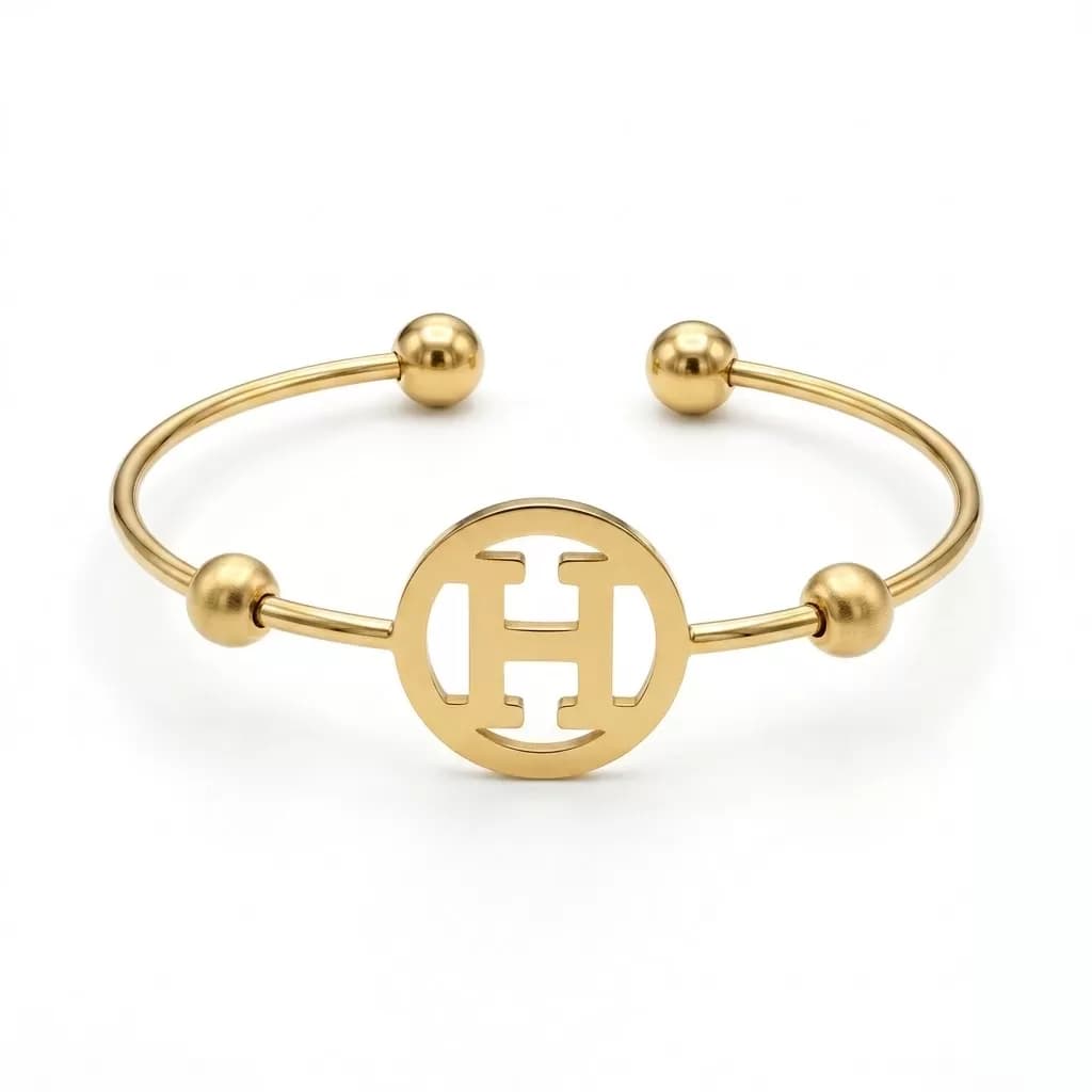 H cut out Gold bangle — image 1