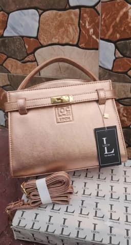 Elegant Rose Gold Structured Satchel & Crossbody Handbag's Image