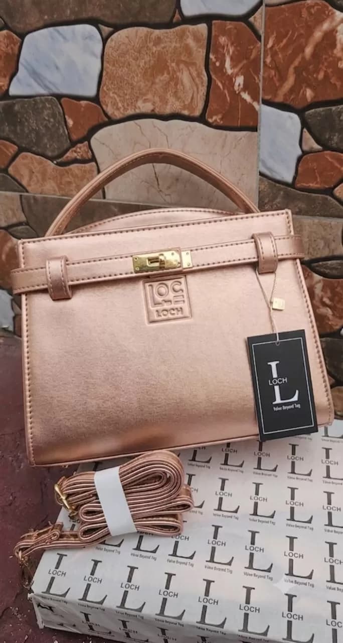 Elegant Rose Gold Structured Satchel & Crossbody Handbag — image 1